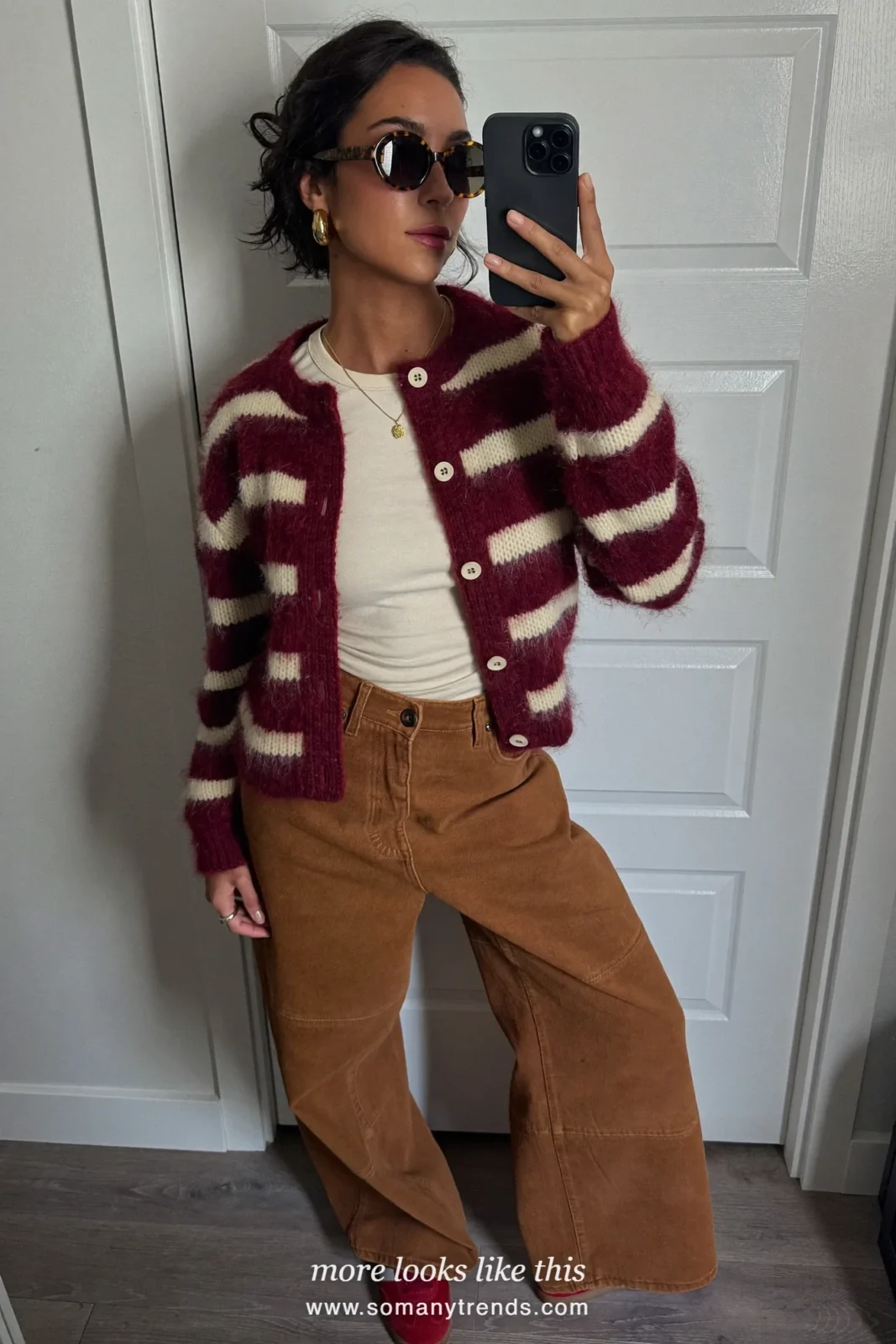 Burgundy and cream striped mohair cardigan with light brown suede wide pants and red sneakers, outfit 9