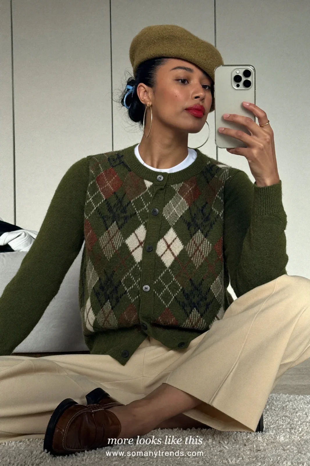 Forest green argyle cardigan with cream wide-leg trousers and brown loafers, outfit 15
