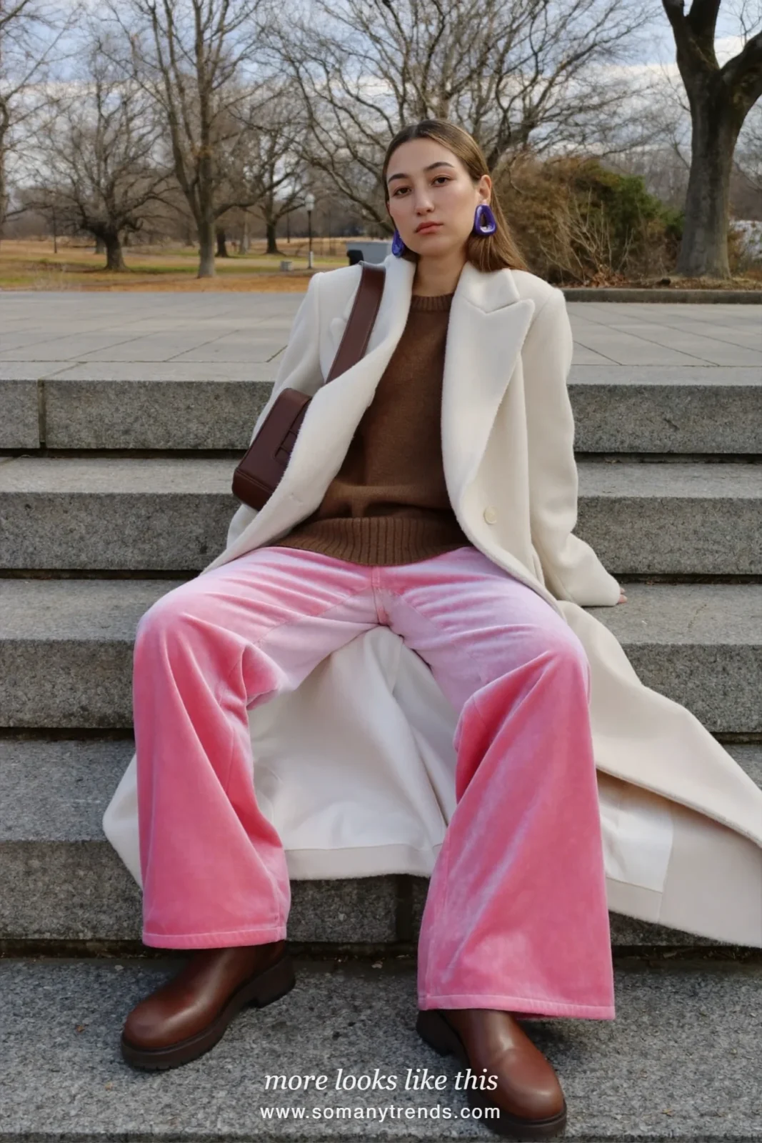 Woman in rose pink velvet wide pants, chocolate brown knit, long cream coat and brown boots, outfit 17