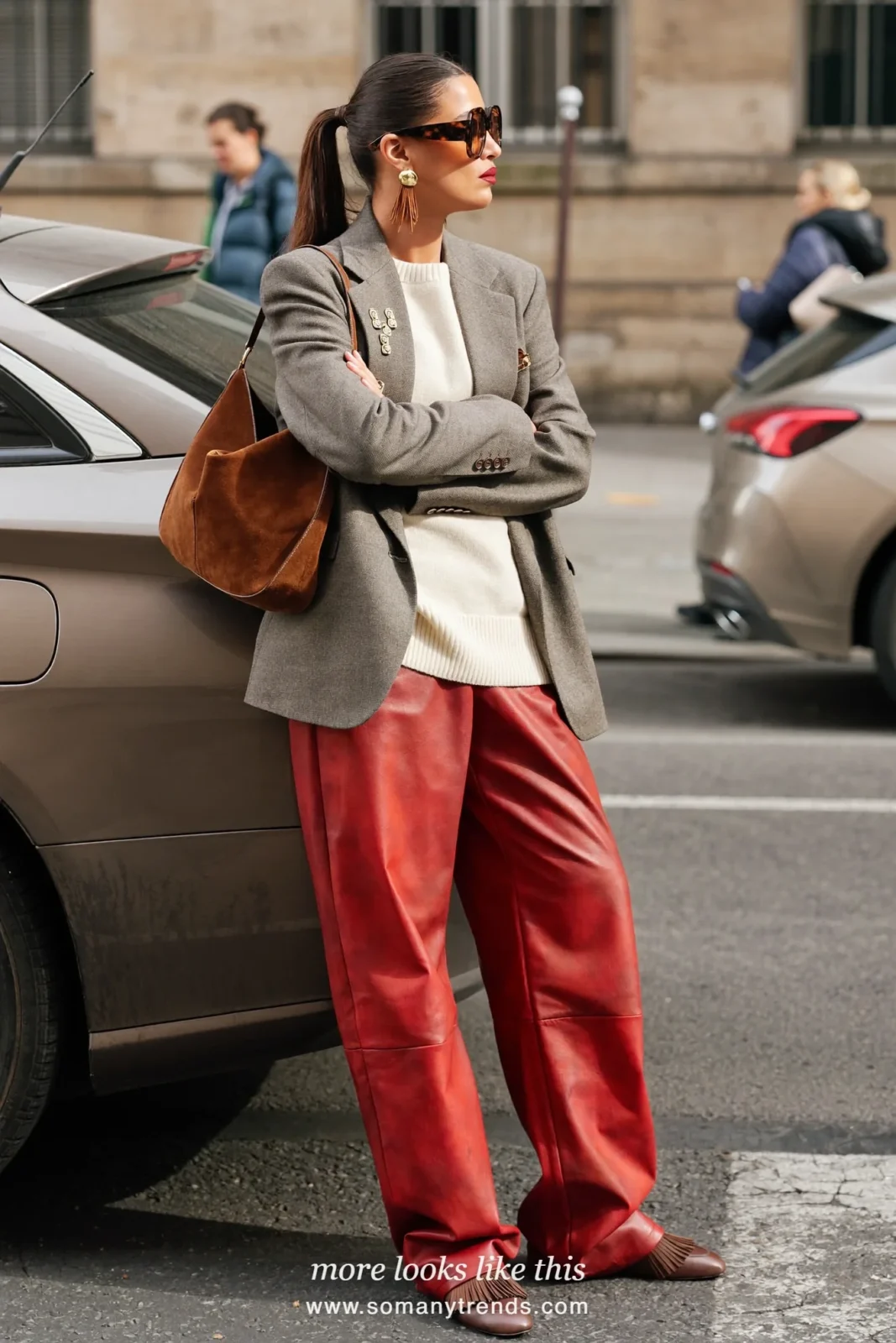 Woman in a gray wool blazer, cream knit, red soft matte leather straight pants and chocolate brown loafers, look 19