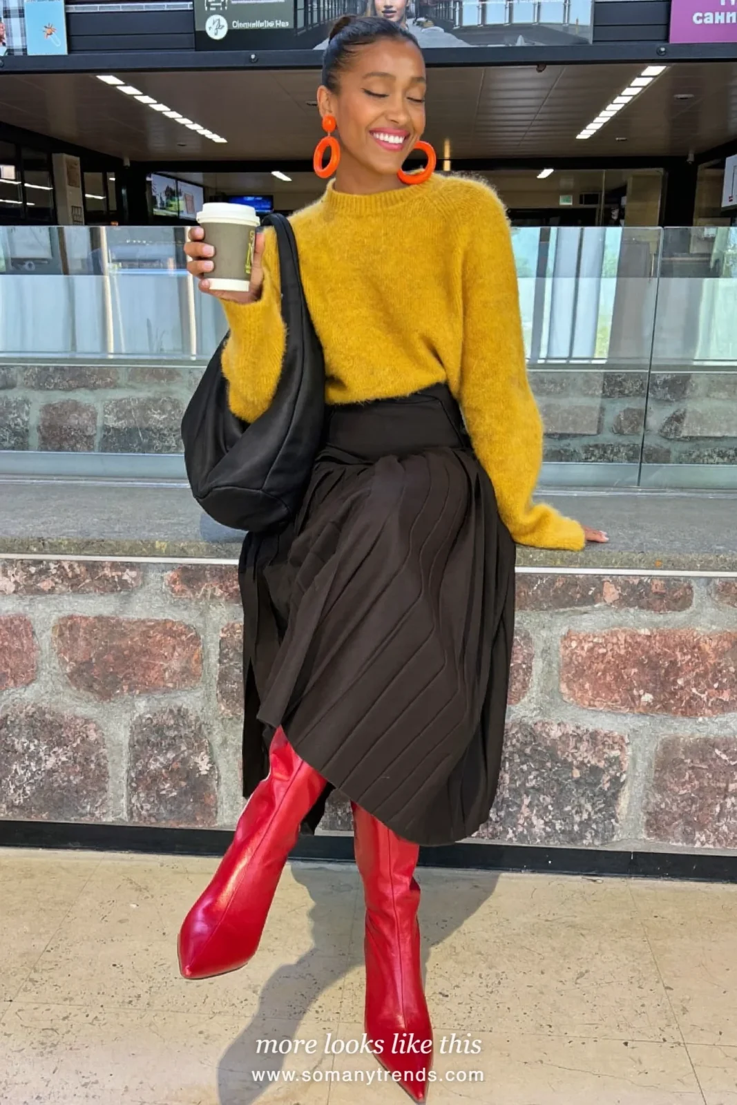 Mustard yellow knit, black pleated midi skirt, red pointed knee-high boots and black bag, outfit 13