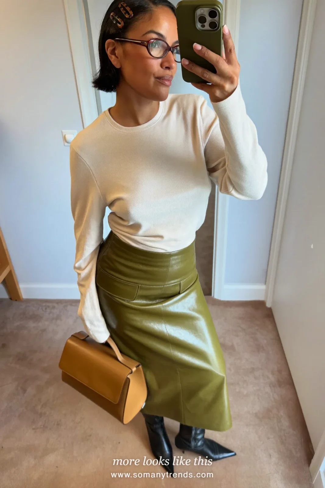 Cream top, olive leather midi skirt, black pointed knee-high boots and tan bag, outfit 21
