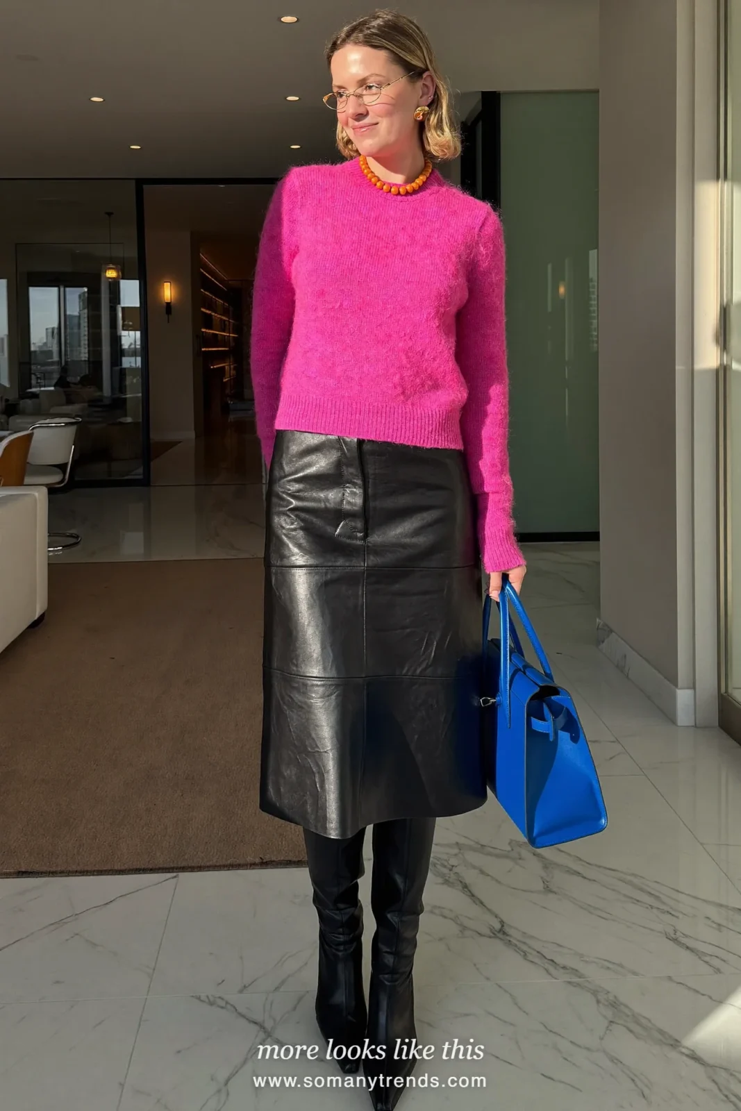 Hot pink mohair sweater, black leather midi skirt, black pointed knee-high boots and cobalt blue top-handle bag, outfit 1