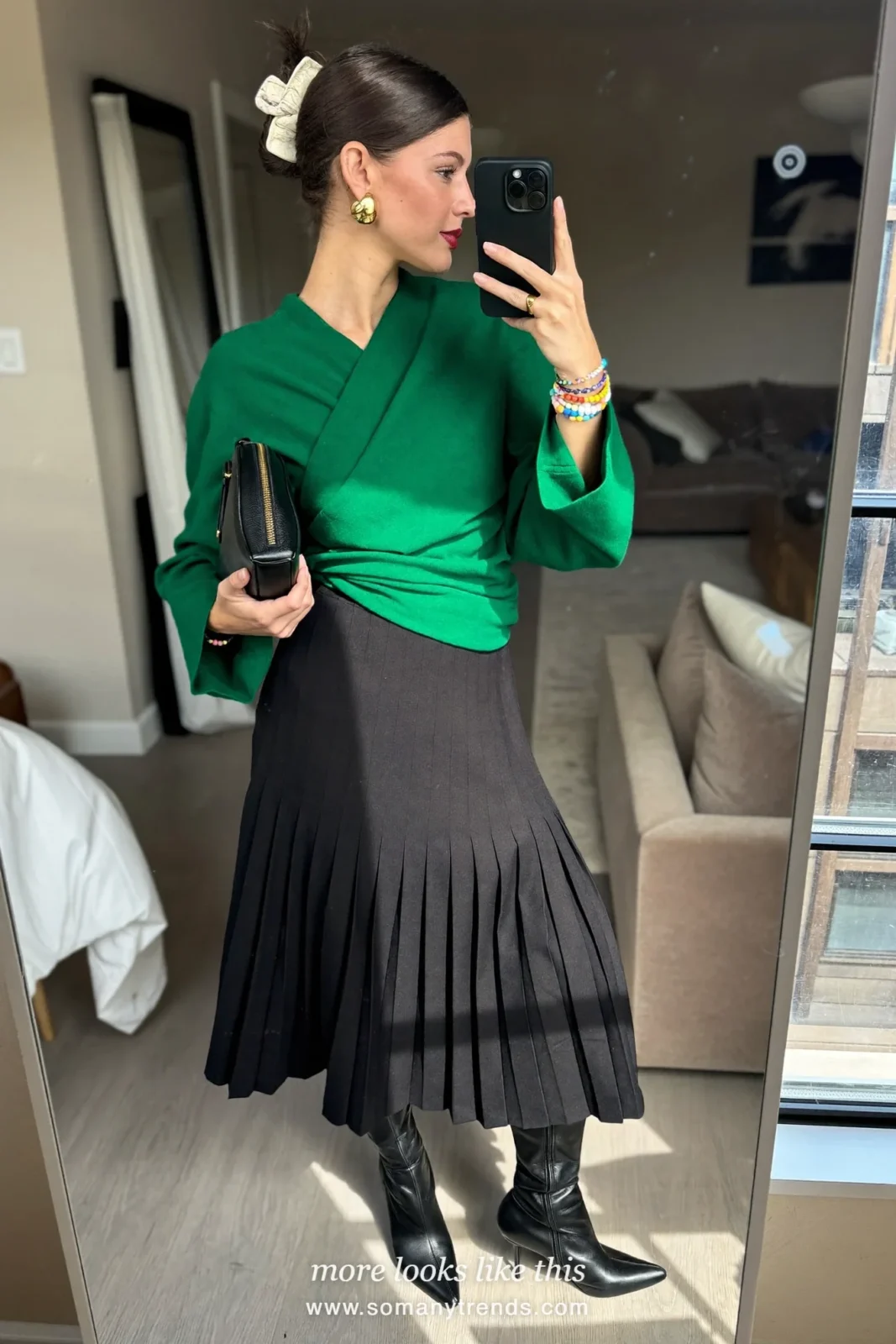 Emerald green top, black pleated midi skirt, sheer black tights, black pointed knee-high boots and black clutch, outfit 24
