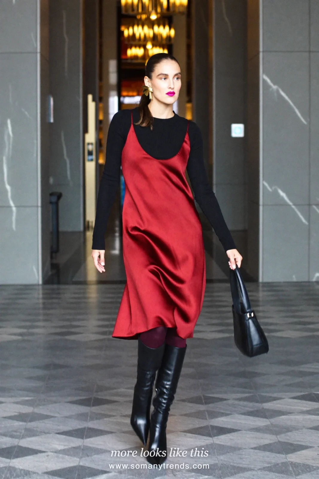 Burgundy satin slip dress to the knee over a black knit top, burgundy opaque tights and black pointed knee-high boots, outfit 25