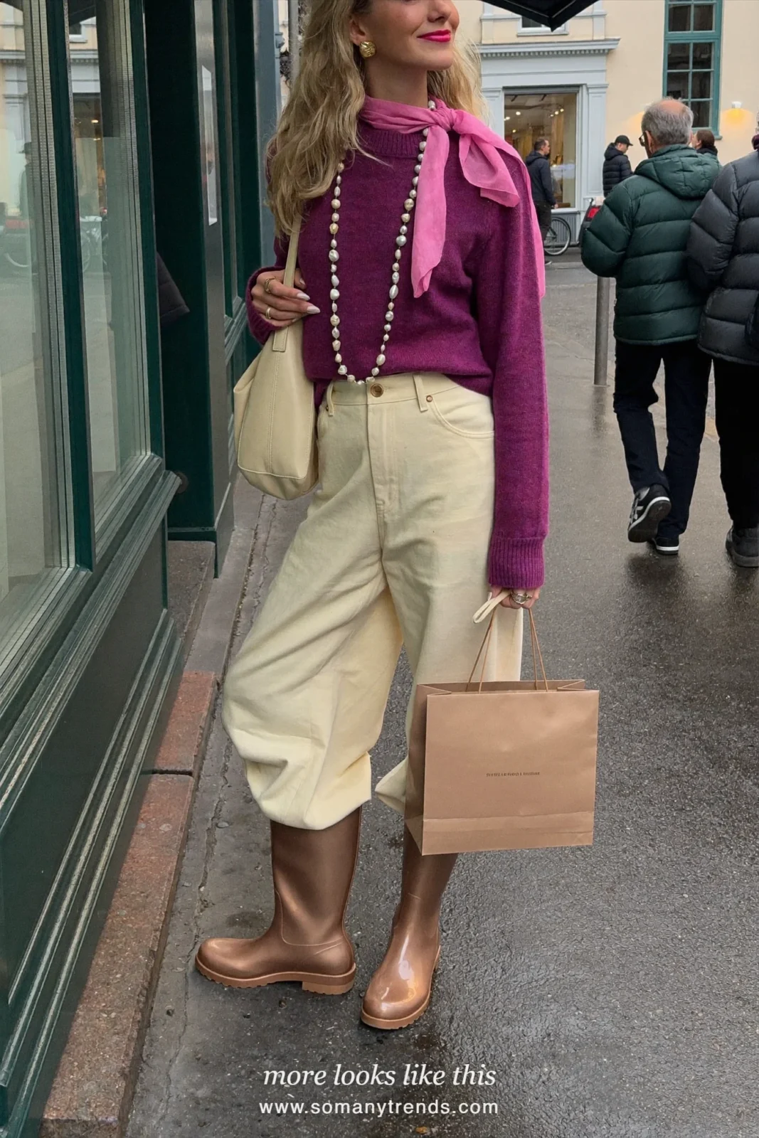 Woman in light metallic bronze tall rain boots, cream straight pants tucked in, plum sweater and hot pink scarf, outfit 20