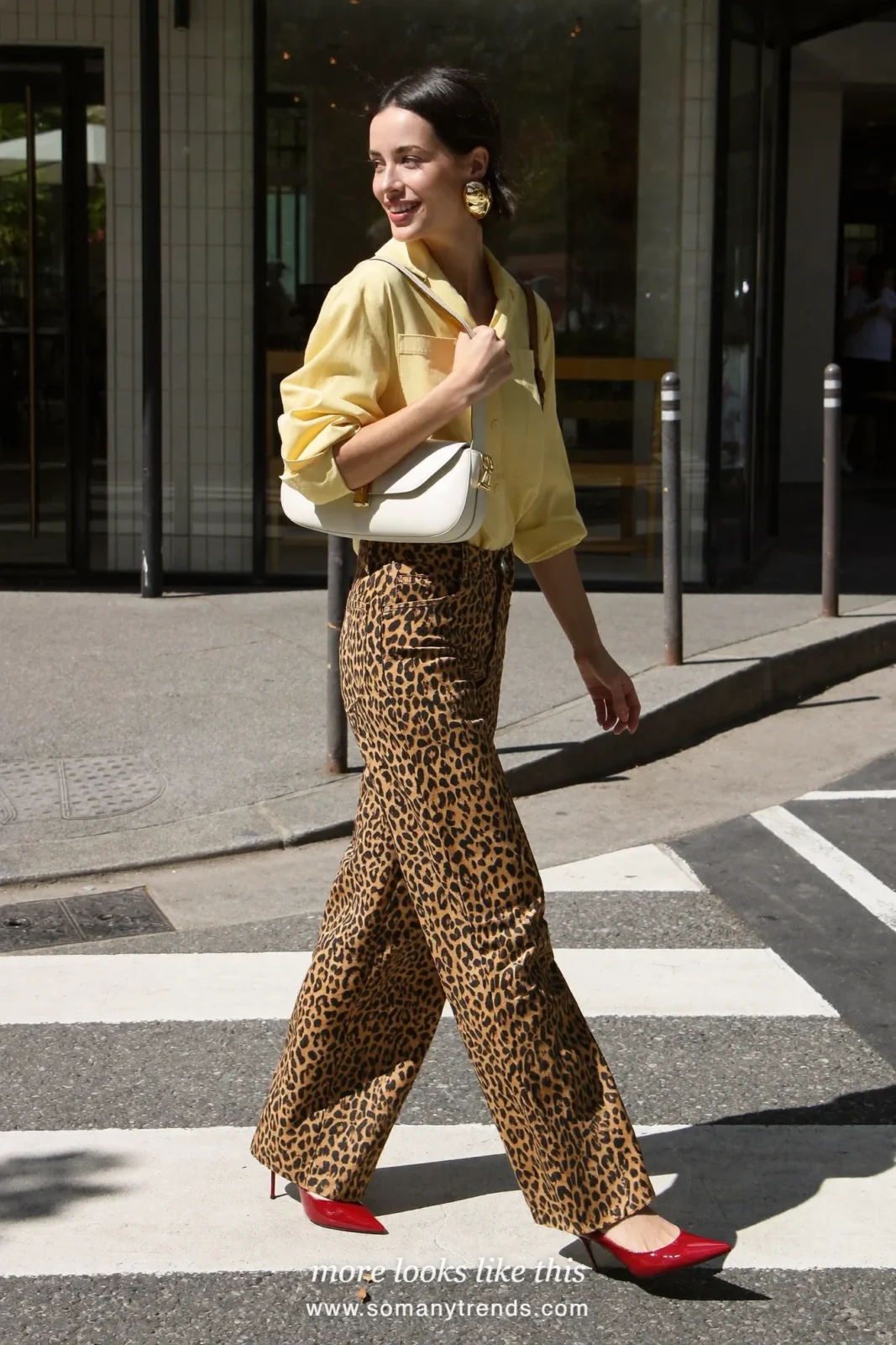 Woman in butter yellow shirt, leopard print straight jeans, red patent pumps and cream bag, outfit 22