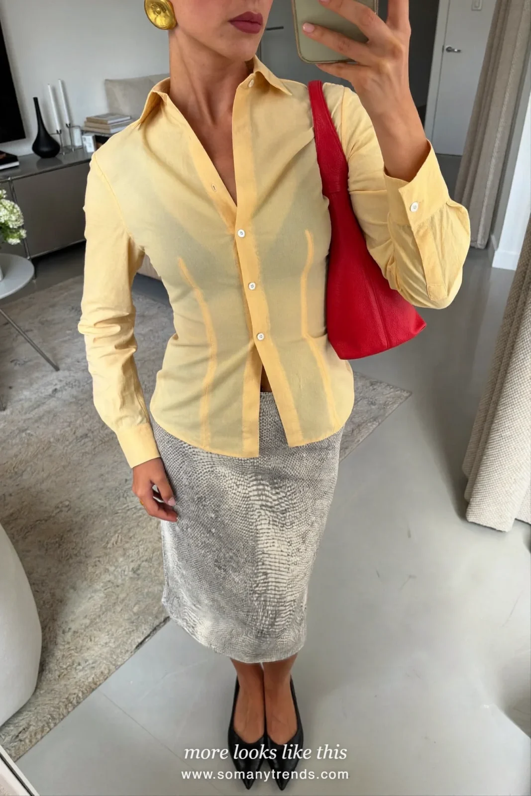 Woman in a butter yellow poplin shirt, gray and white snake print column skirt, black pointed flats and a cherry red bag, outfit 21