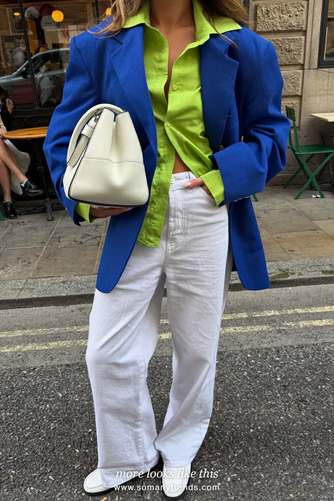 Woman in a cobalt blue blazer over a lime green poplin shirt with white wide-leg pants and white loafers, outfit 17