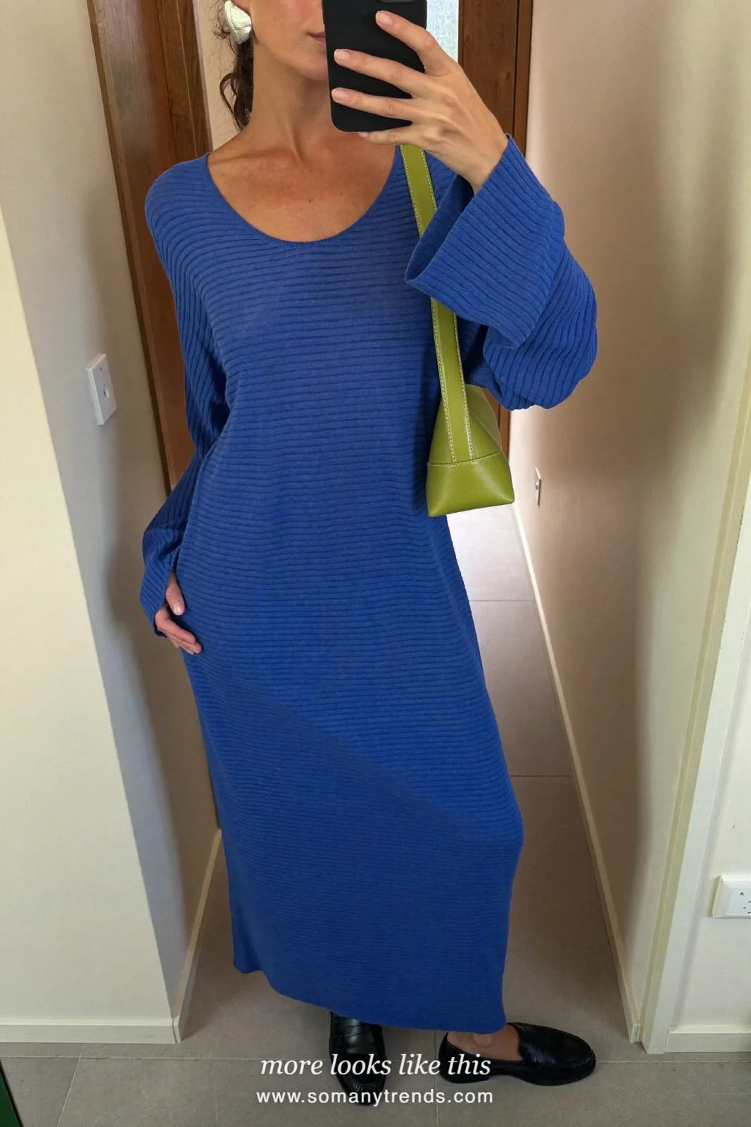 Woman in a loose cobalt blue knit maxi dress with black loafers and a small lime green shoulder bag, outfit 18