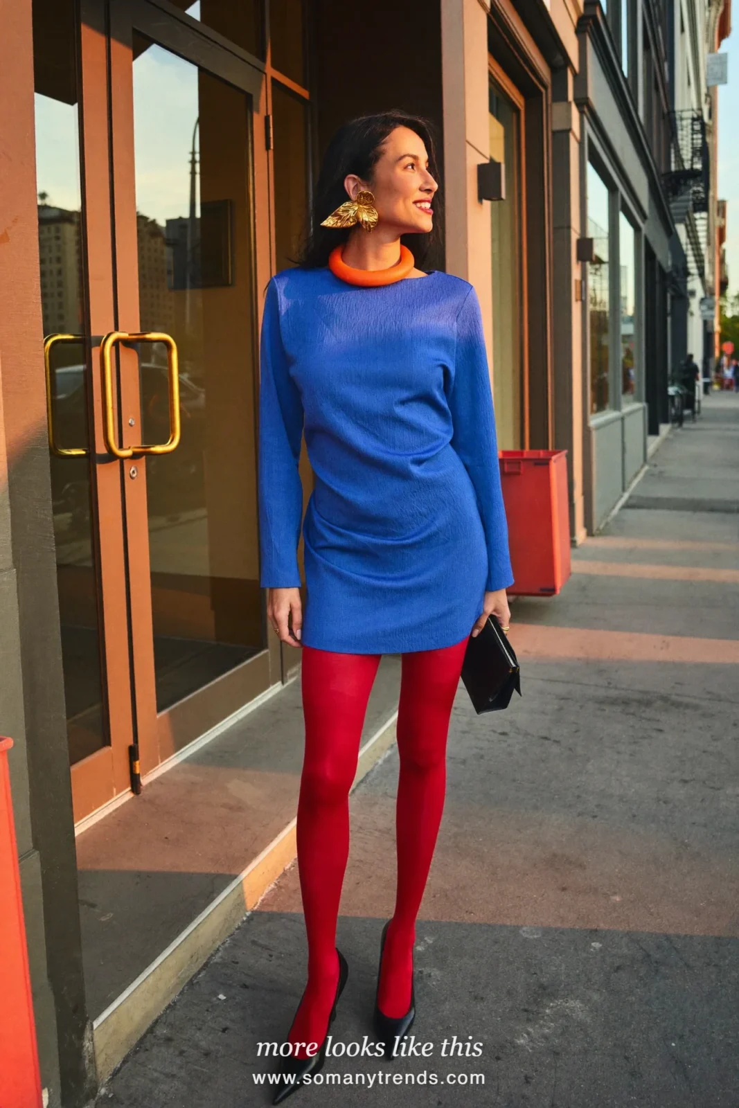 Woman in a long-sleeve cobalt blue mini dress with cherry red opaque tights and black pumps, outfit 23