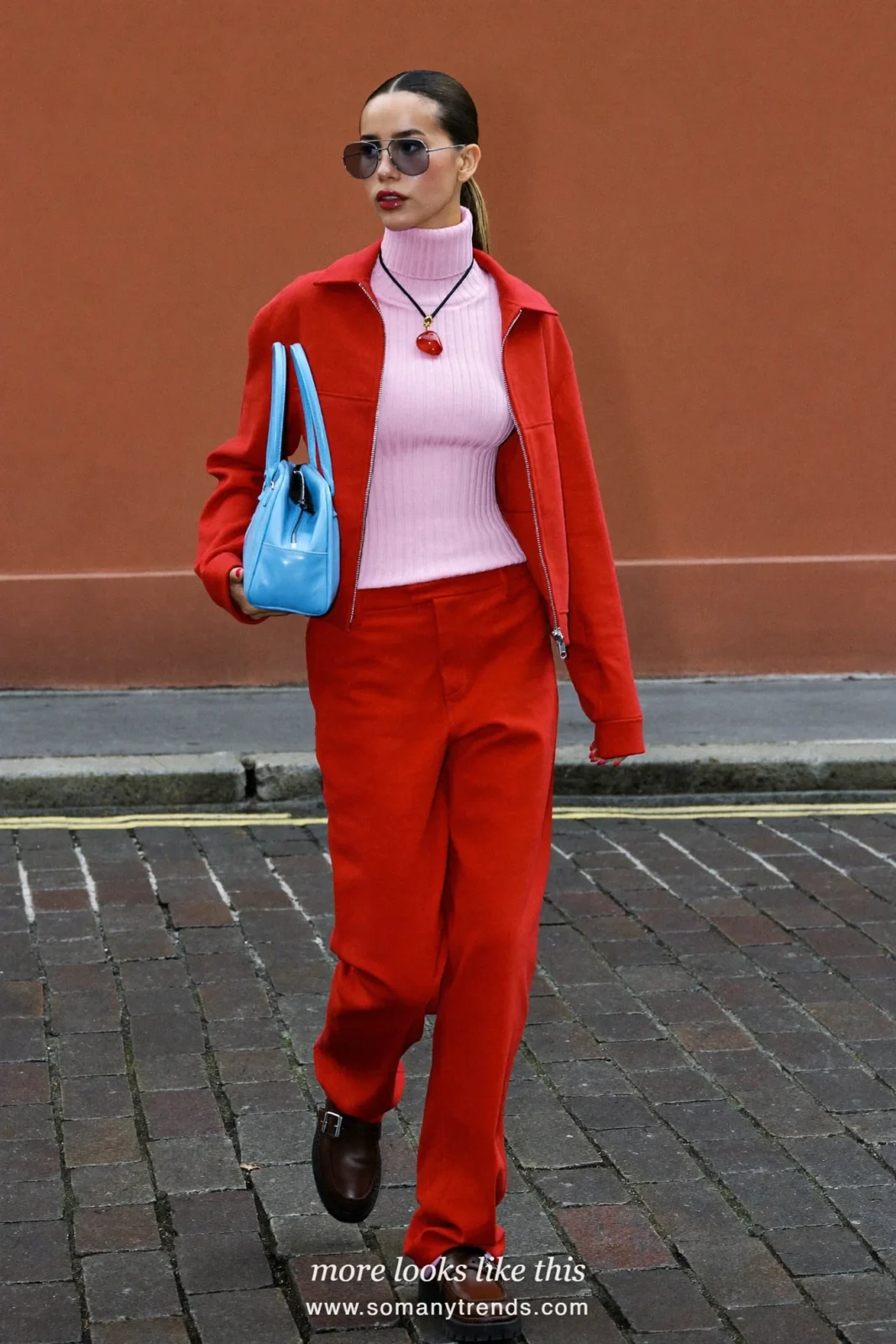 Pale pink ribbed turtleneck, red zip short jacket, red wide-leg pants and brown loafers, outfit 1