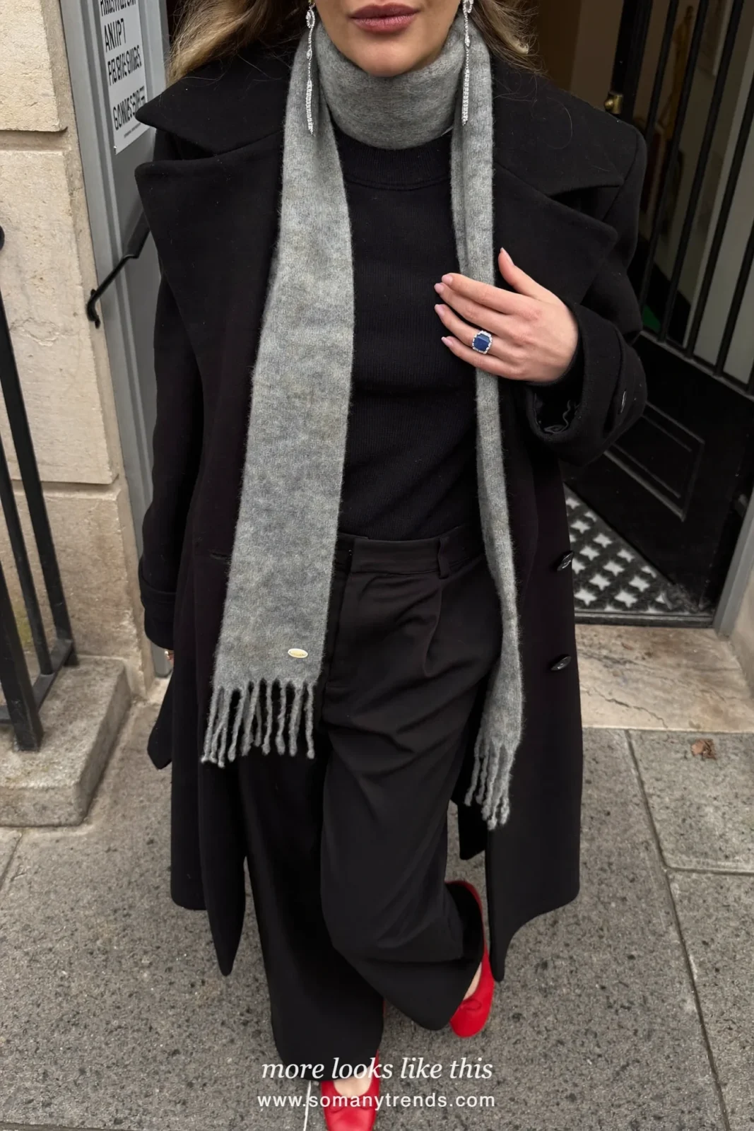 Woman in a long black coat, black pants, red leather ballet flats, gray scarf and a leopard print shoulder bag, outfit 7
