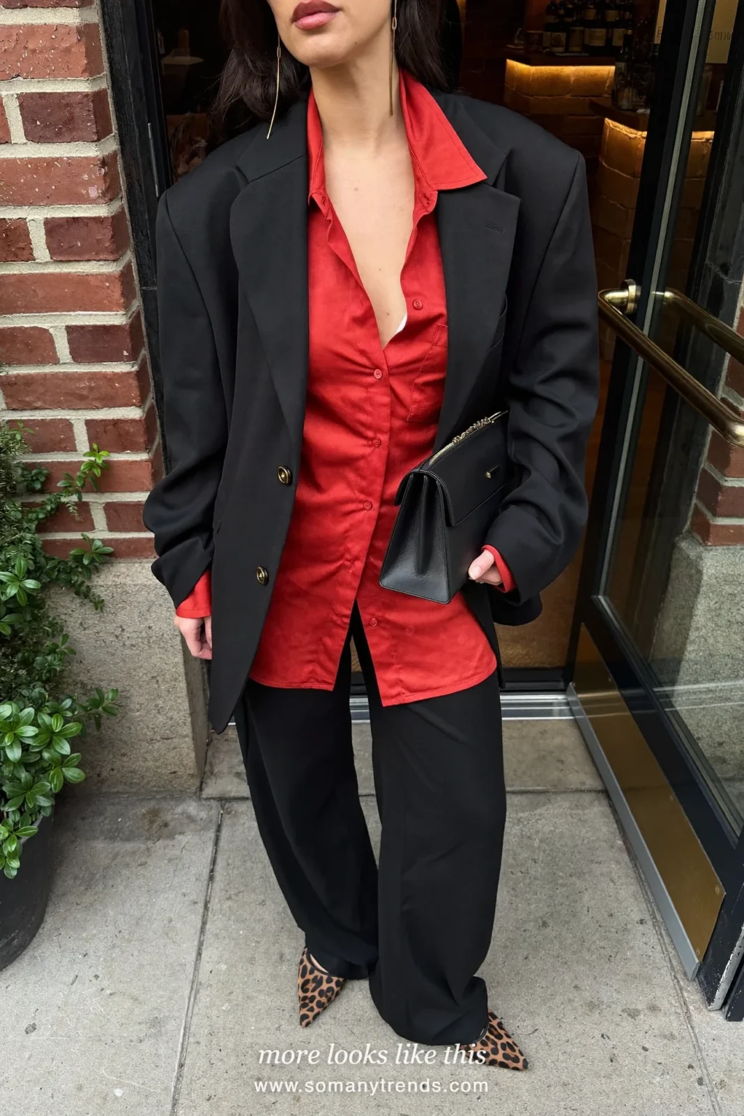 Woman in a red satin blouse, black wide-leg pants and leopard print pointed flats, outfit 11