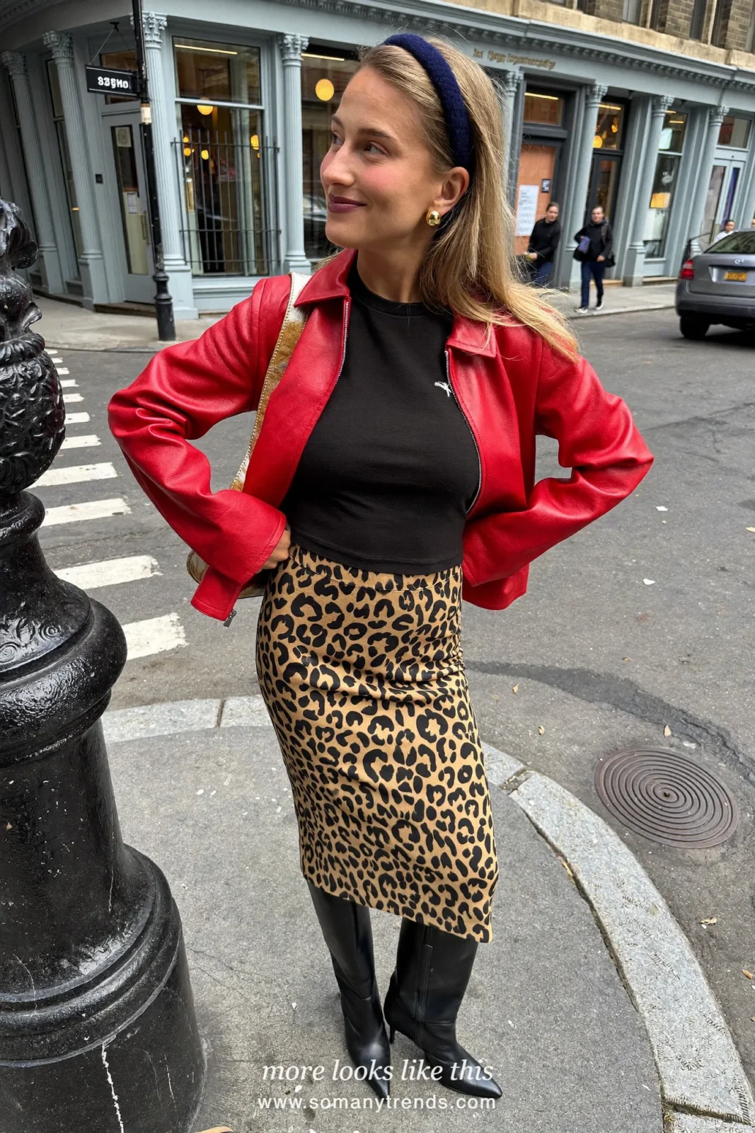 Woman in a red leather jacket, black tee, leopard print midi skirt and black tall boots, outfit 13