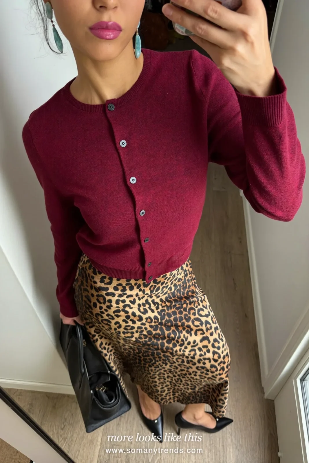 Woman in a burgundy fine-knit cardigan, leopard satin midi skirt and black pointed pumps, outfit 6