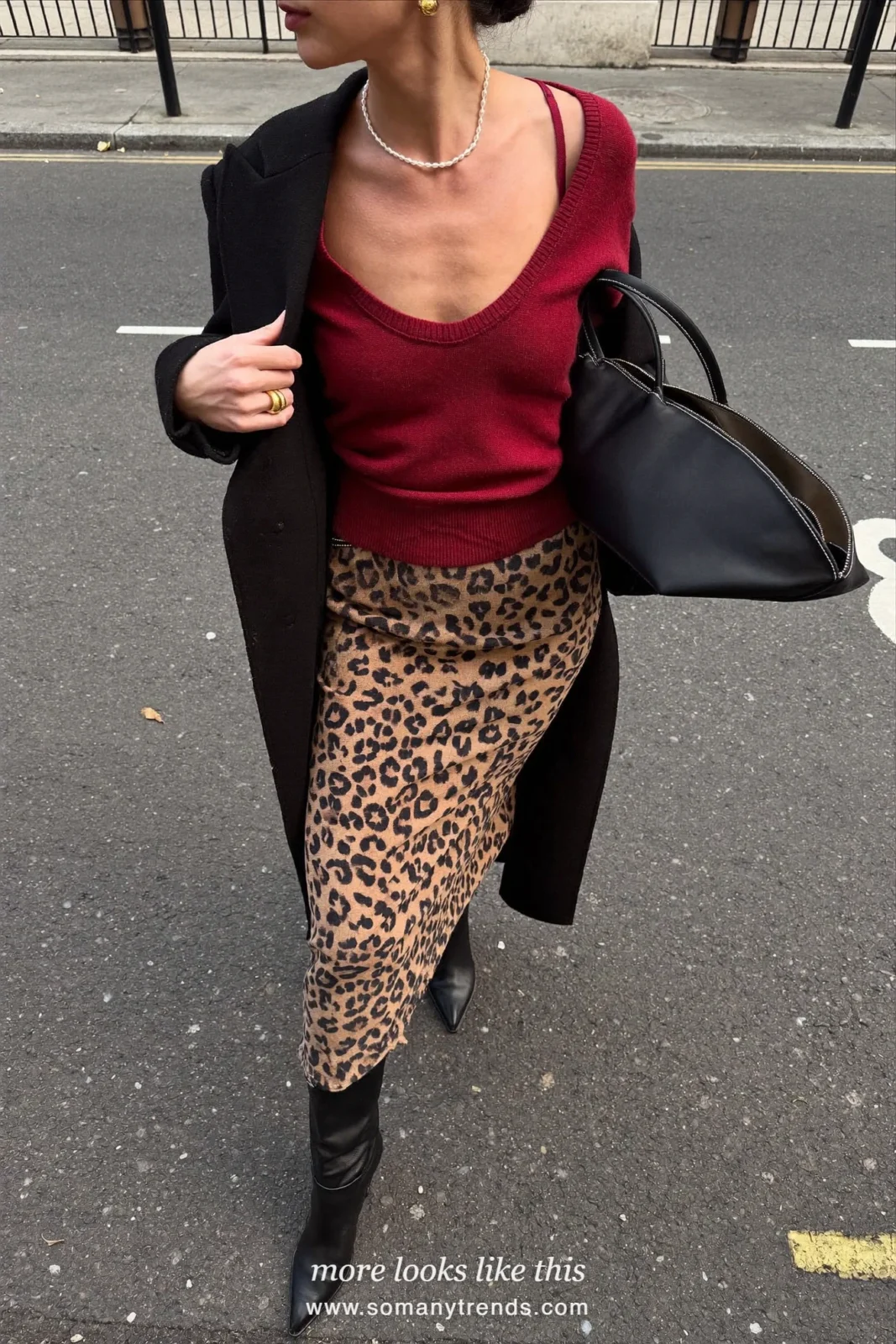Woman in a burgundy knit top, leopard print midi slip skirt, black knee-high boots and a black tote, outfit 10
