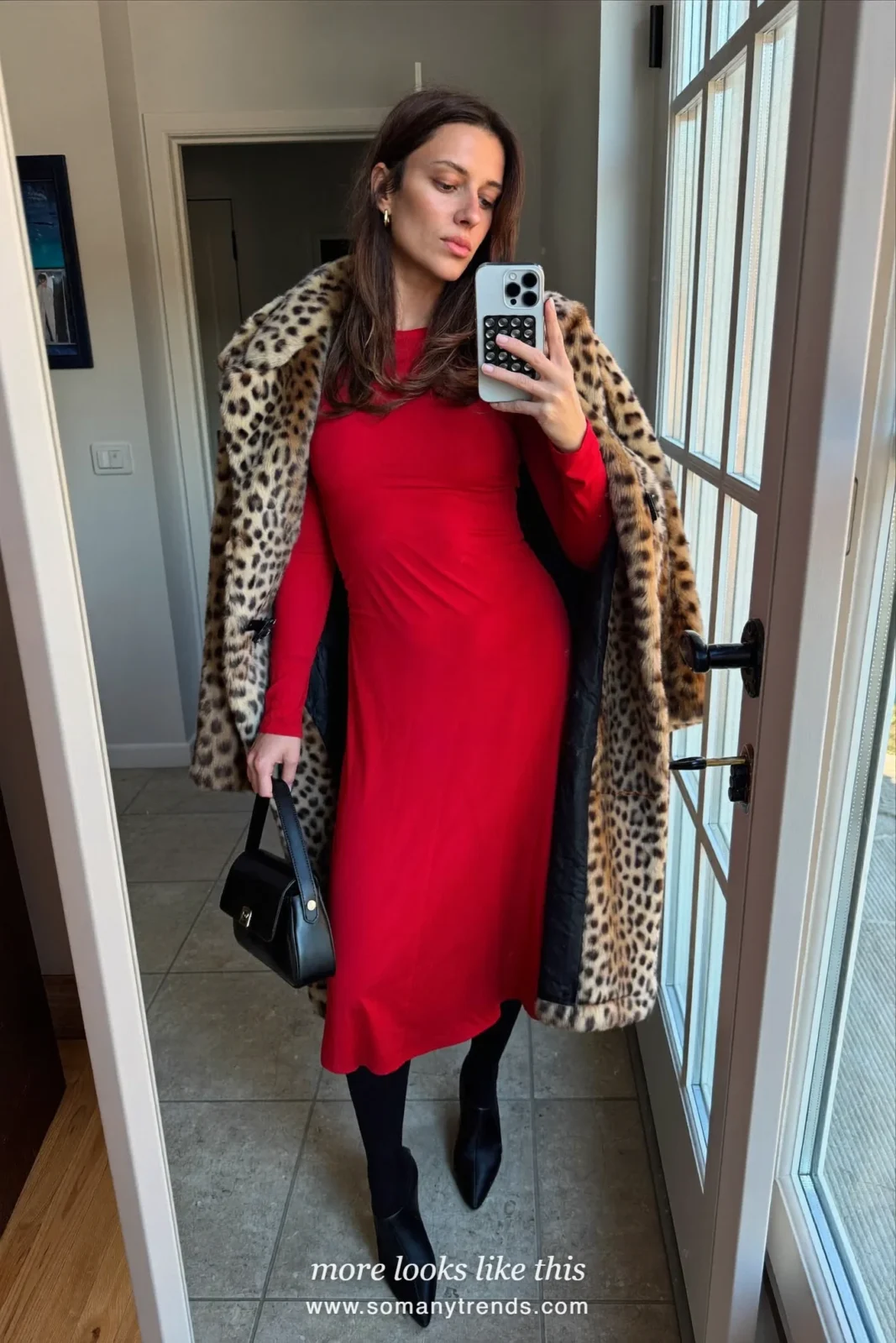Woman in a leopard print coat, red midi dress and black boots, outfit 24
