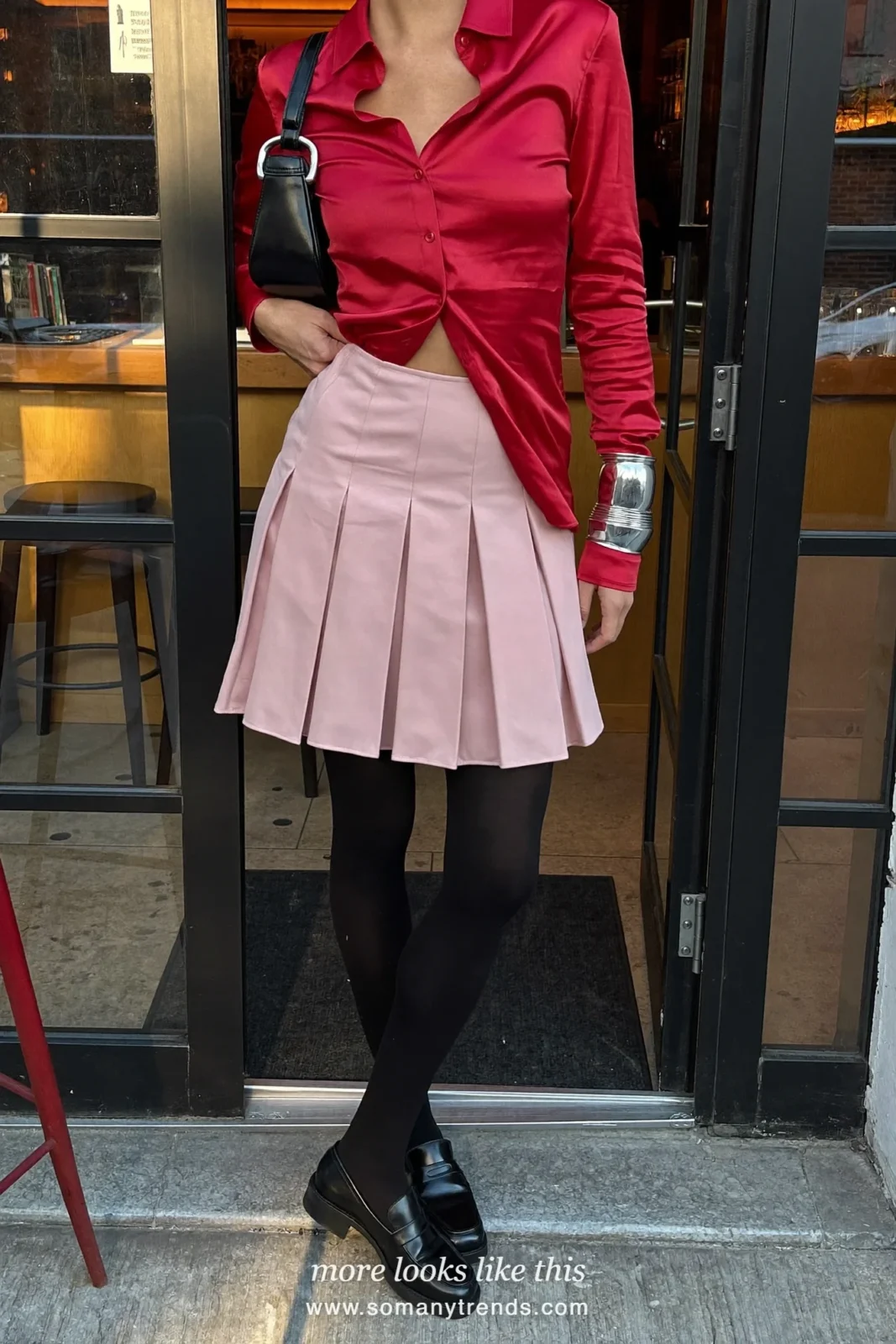 Red satin shirt, pale pink pleated mini skirt, black opaque tights, black chunky loafers and cobalt blue bag, outfit 13