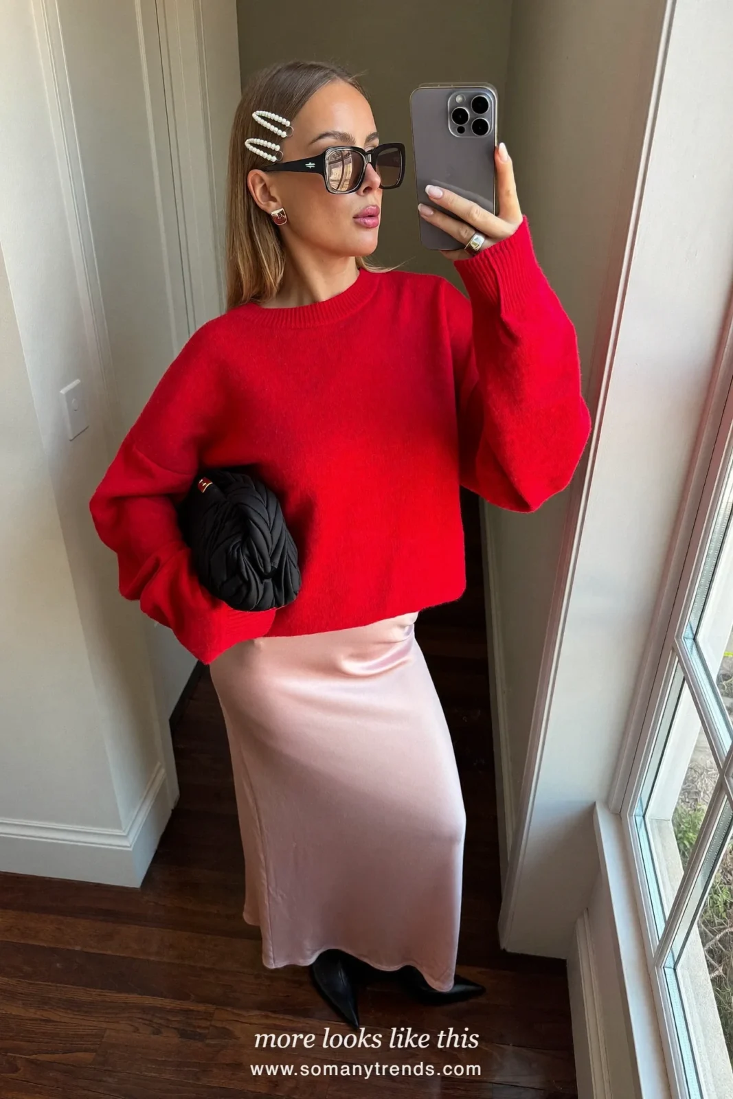 Red knit sweater, pink satin midi skirt, black pointed boots and black clutch, outfit 18