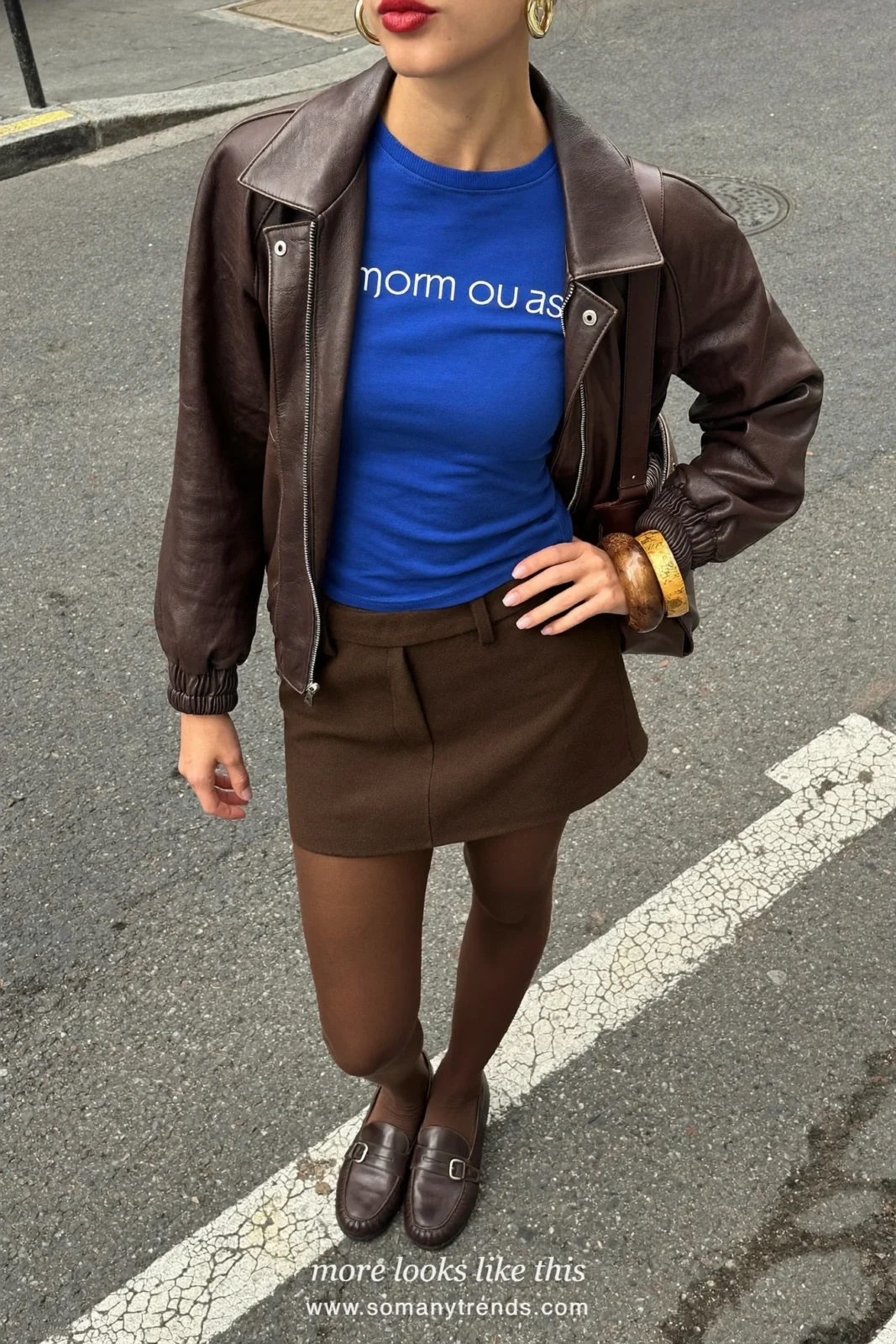 Look 1: dark brown leather bomber jacket, royal blue fitted tee, brown tights and brown ankle boots