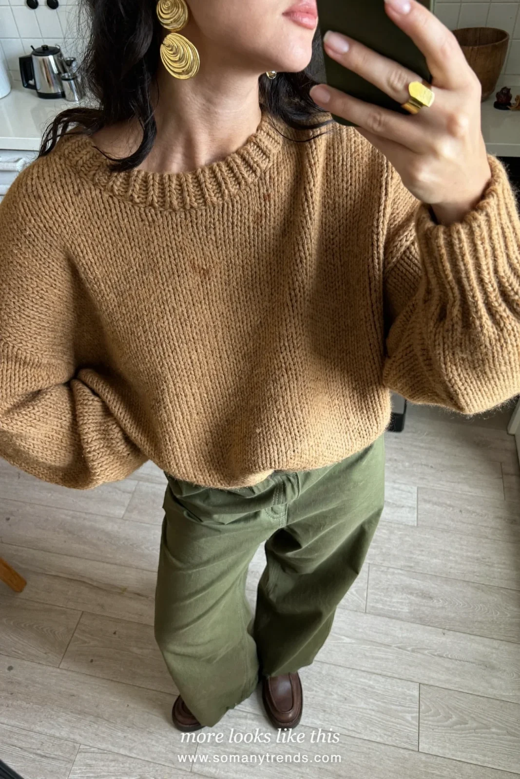 Look 18: tan knit sweater, olive wide-leg pants and brown leather boots
