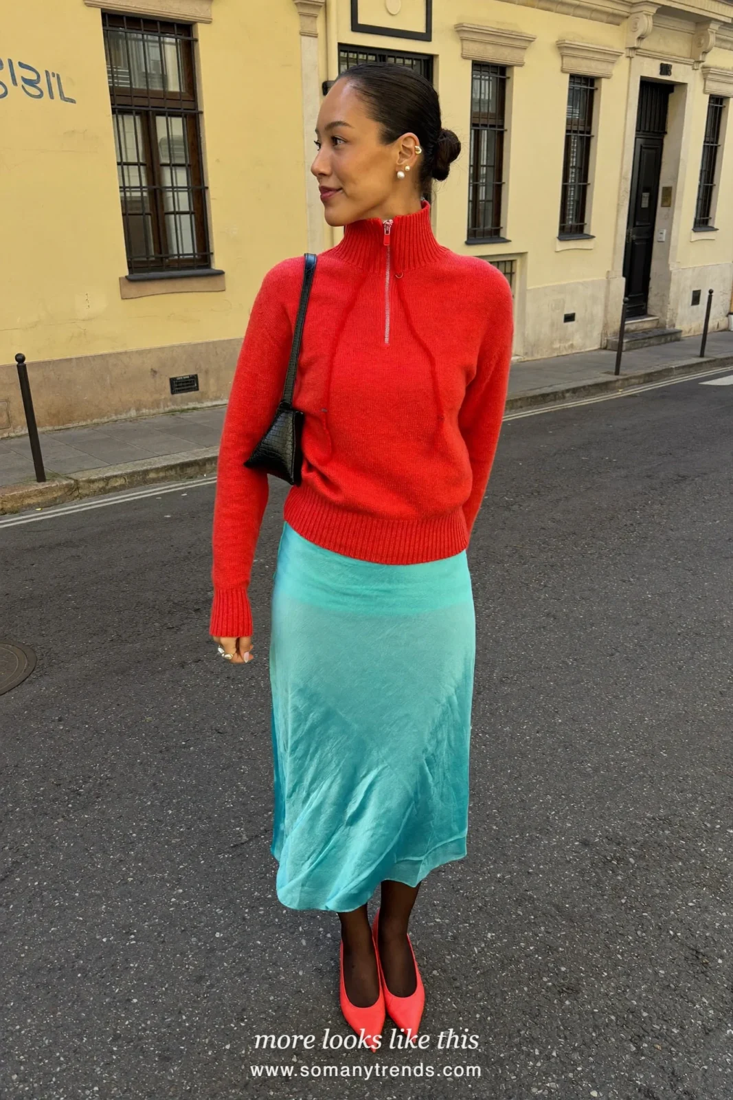 Woman in a coral red zip pullover, aqua lace midi skirt and red pointed pumps, outfit 13