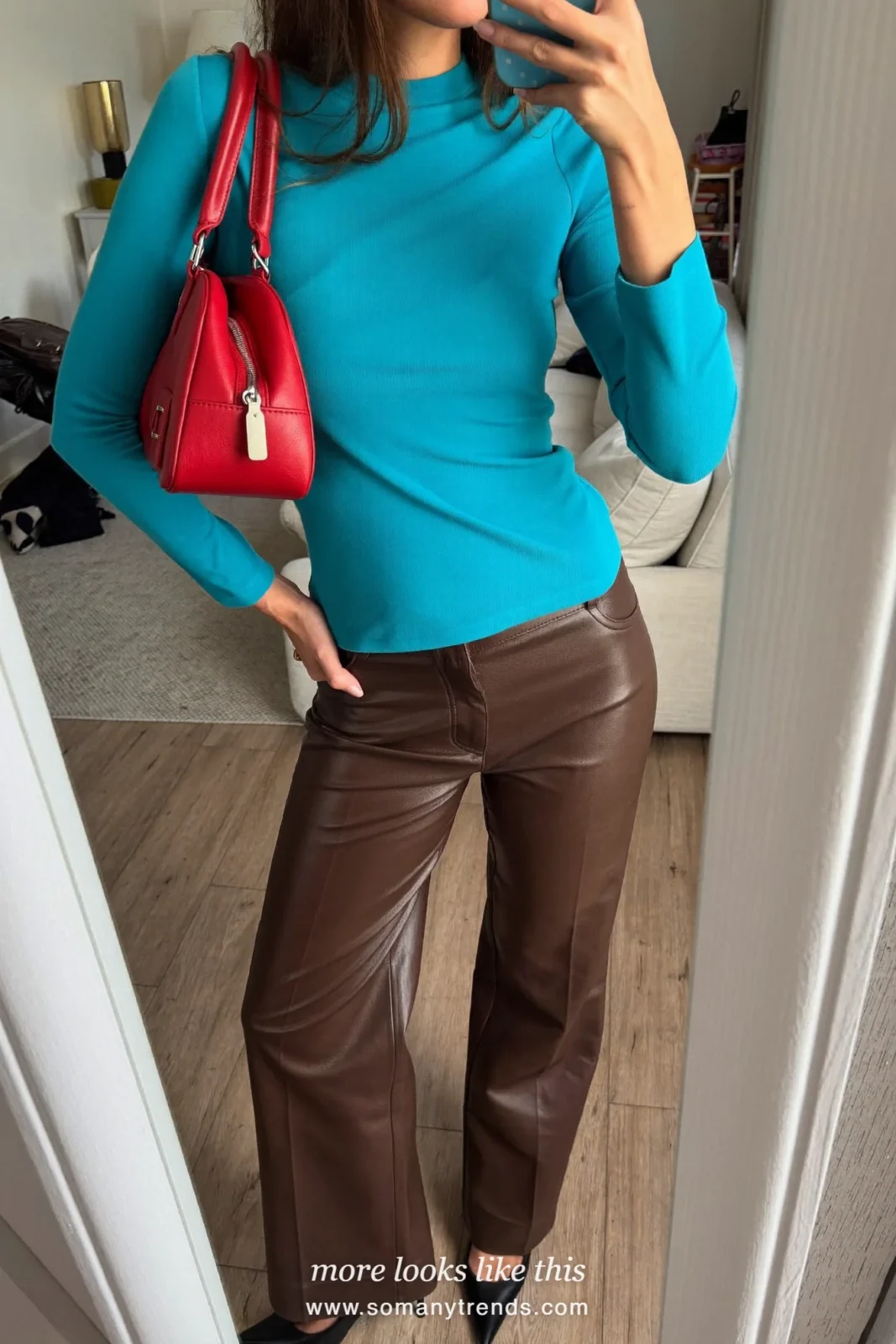 Woman in brown leather pants, aqua top, coral red bag and black heels, outfit 24