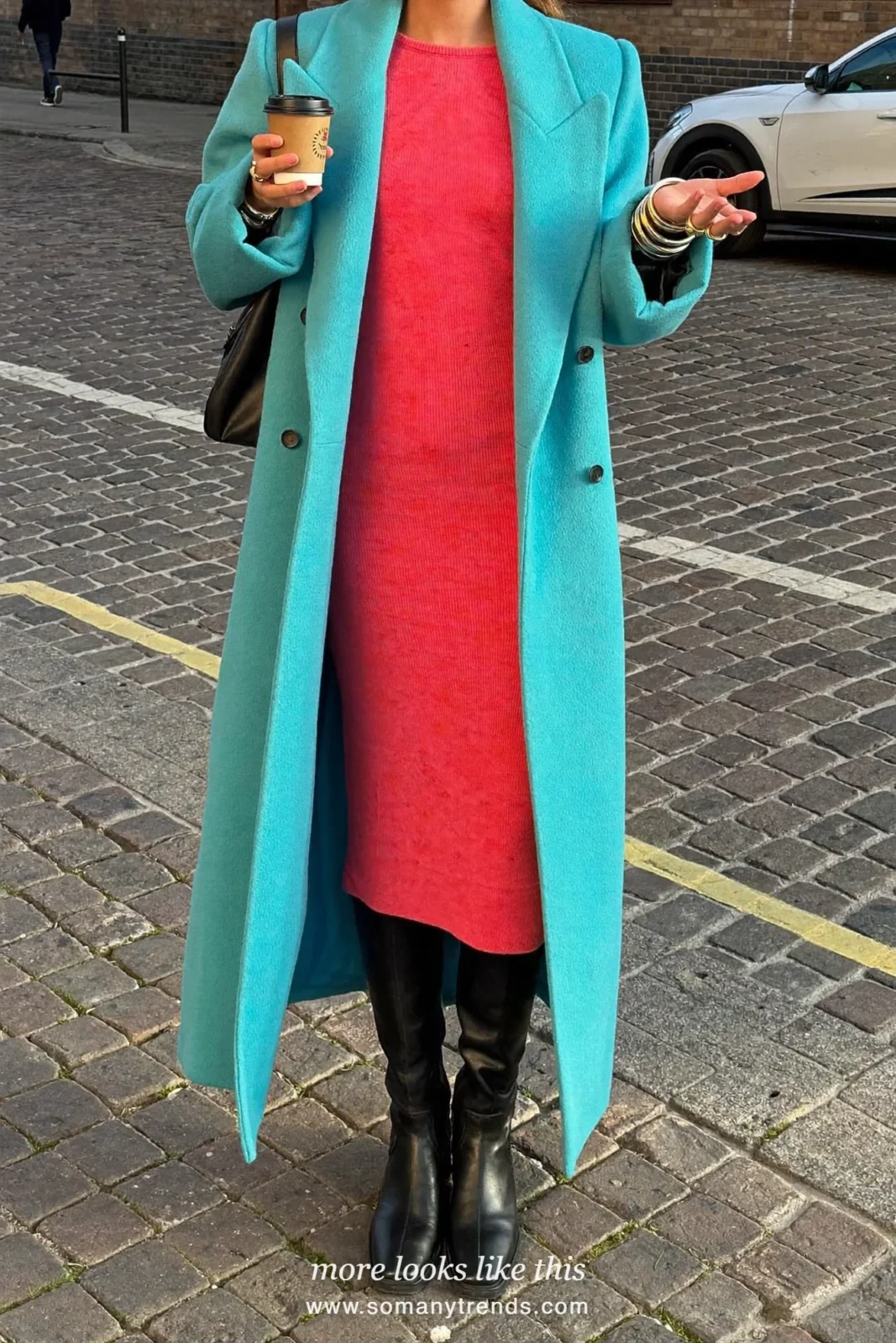 Woman in a long aqua coat, coral red knit dress, black tights and boots, outfit 25