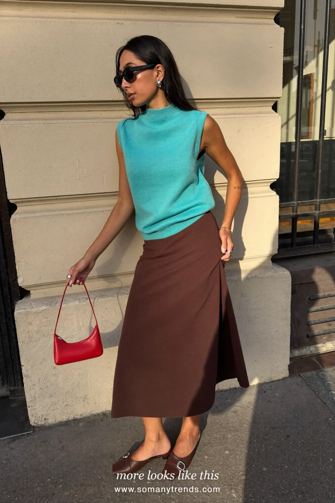 Woman in a sleeveless aqua knit top, chocolate brown midi skirt and brown suede mules, outfit 5