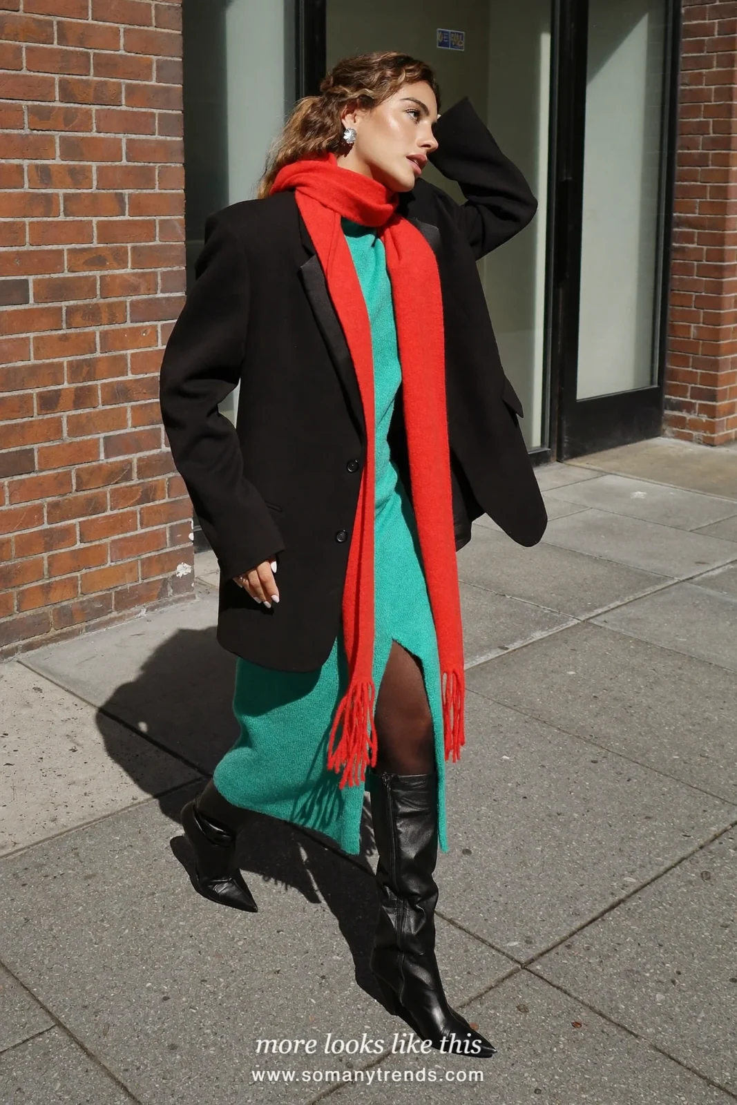 Woman in an oversized black blazer, aqua knit dress, coral red scarf and black boots, outfit 14