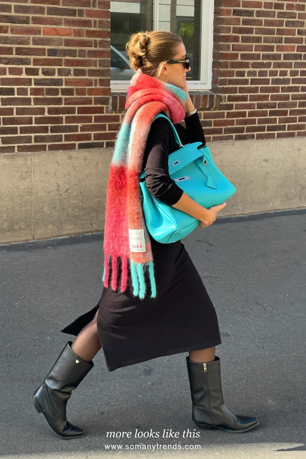 Woman in a black midi dress, coral red scarf, aqua bag and black boots, outfit 27